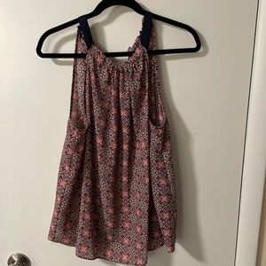 High neck, halter style tank.